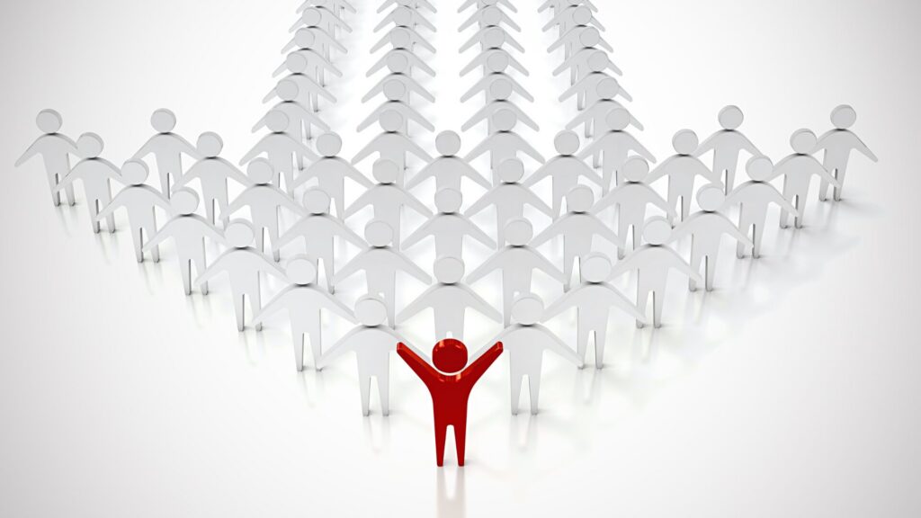 Groupe d’individus avec un leader en rouge symbolisant la position internationale de LaserAddict comme leader du bien-être.
